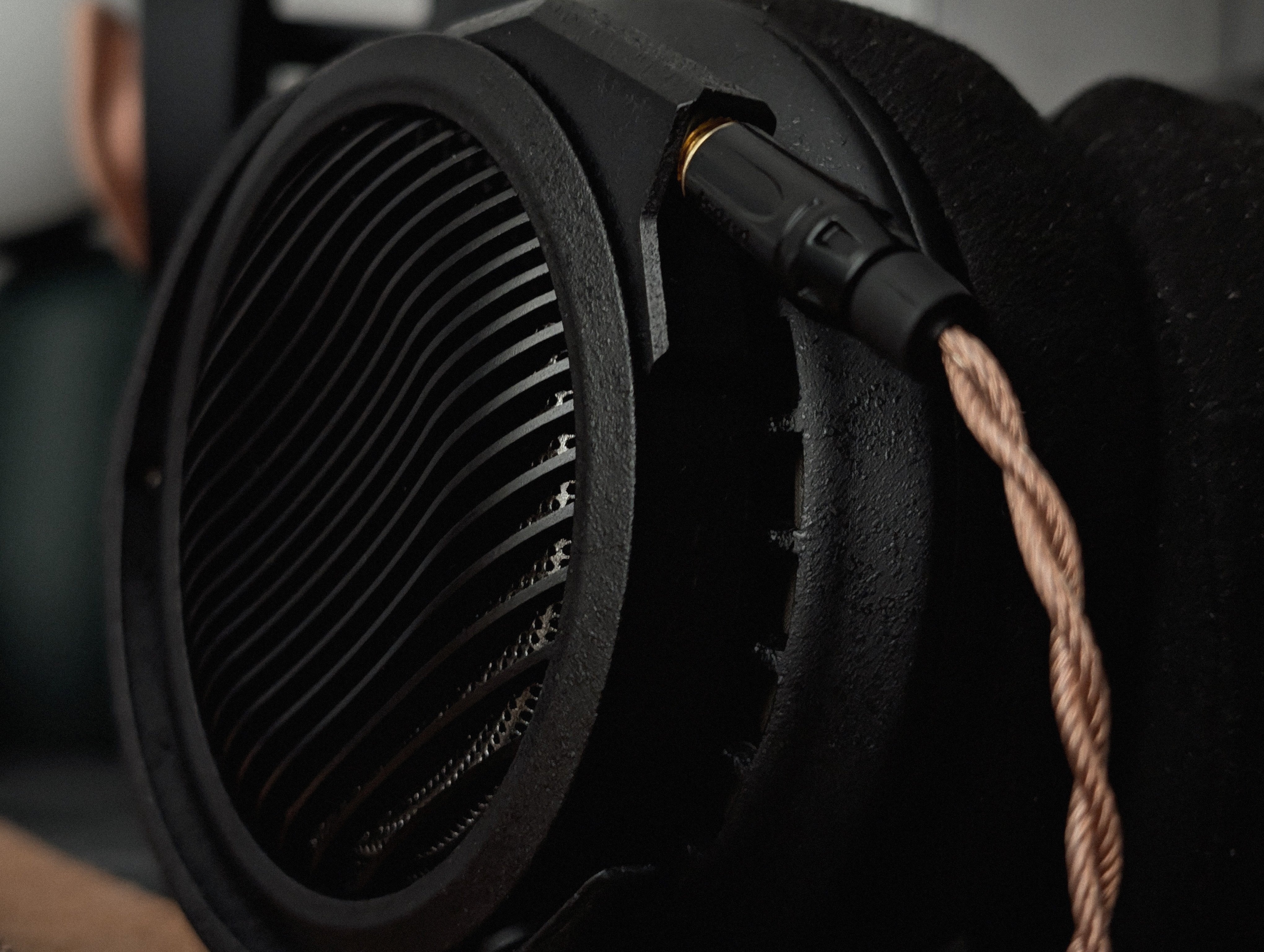 Close-up of Mirph Designs VITRUM earcup Forged Obsidian Texture finish
